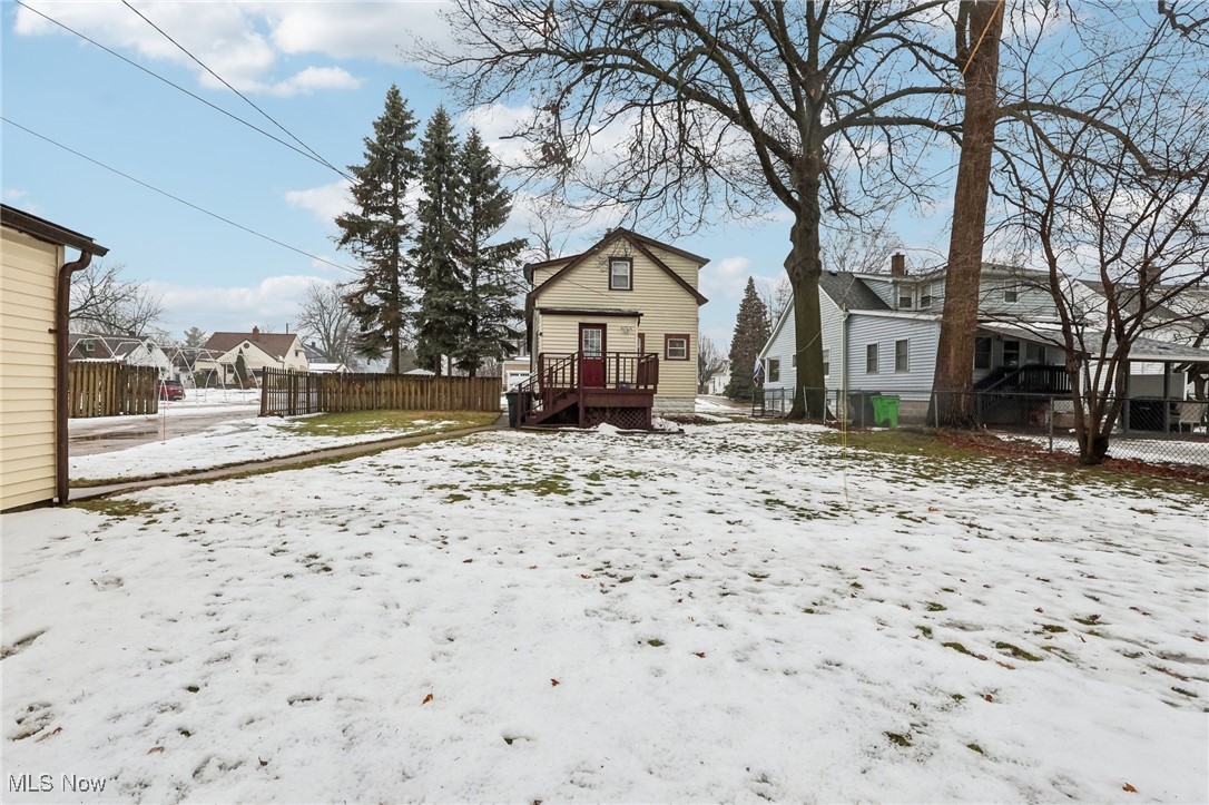 1573 Roselawn Road Cleveland, OH 44124 - Photo 23 of 25 Snowy yard featuring a deck