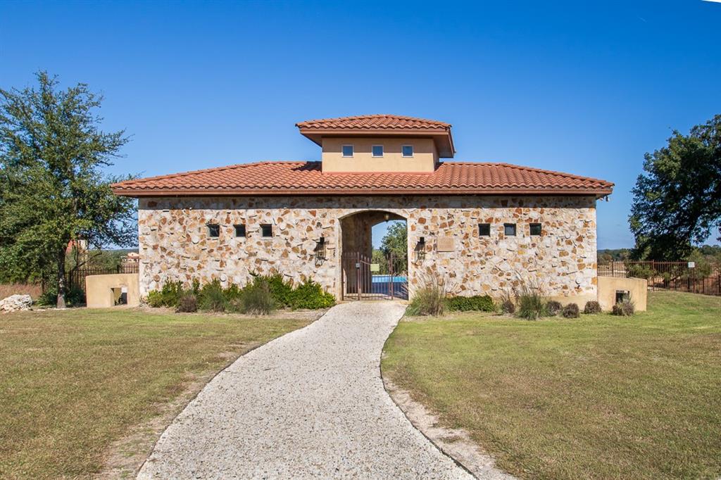 404 Strada Luca Florence, TX 76527 - Photo 22 of 25 a front view of a house with garden