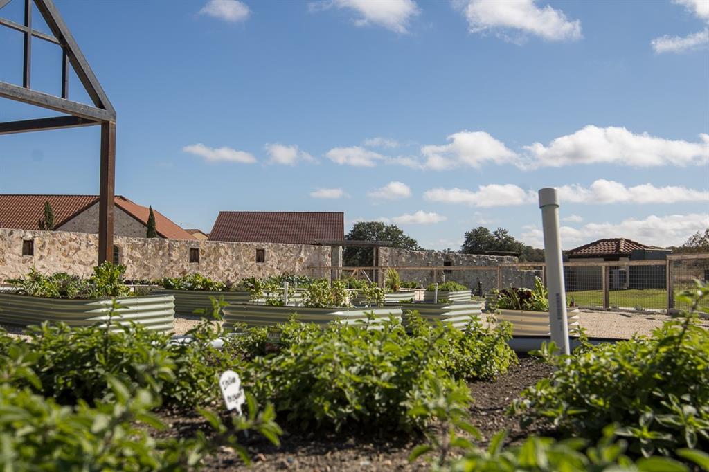 404 Strada Luca Florence, TX 76527 - Photo 3 of 25 a view of a lake with a house in the background