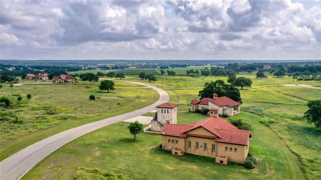 404 Strada Luca Florence, TX 76527 - Photo 10 of 25 an aerial view of a house with a garden and lake view