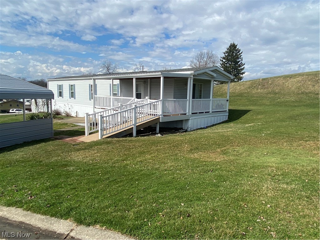 85 Rains Circle Zanesville, OH 43701 - Photo 2 of 15 View of front of house with a front lawn and a porch, nice ramp