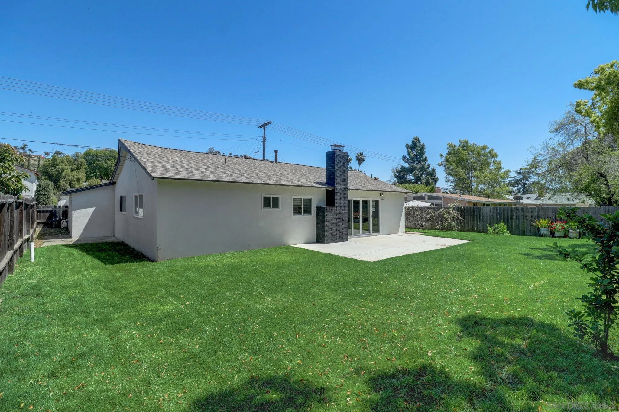 14116 Powers Road Poway, CA 92064 - Photo 42 of 63 a view of a house with backyard and a garden