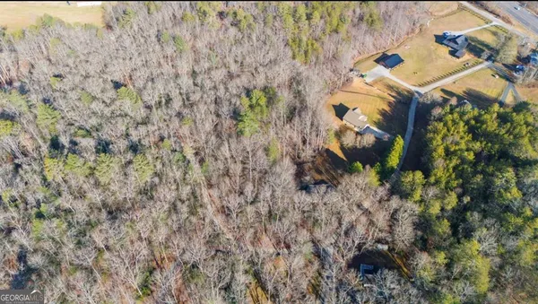 a aerial view of a house with a yard