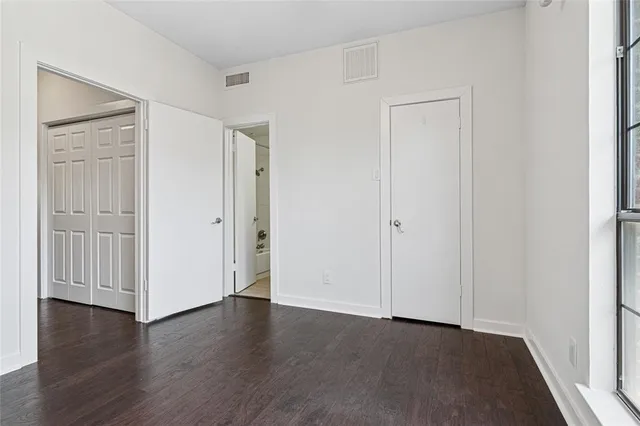 a bathroom with a toilet and shower