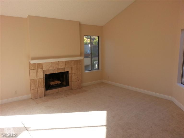 1754 Sinaloa Road, Unit 276 Simi Valley, CA 93065 - Photo 3 of 13 a view of empty room with a fireplace