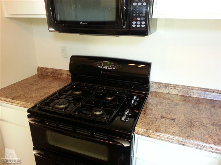 1754 Sinaloa Road, Unit 276 Simi Valley, CA 93065 - Photo 7 of 13 a close up of a stove
