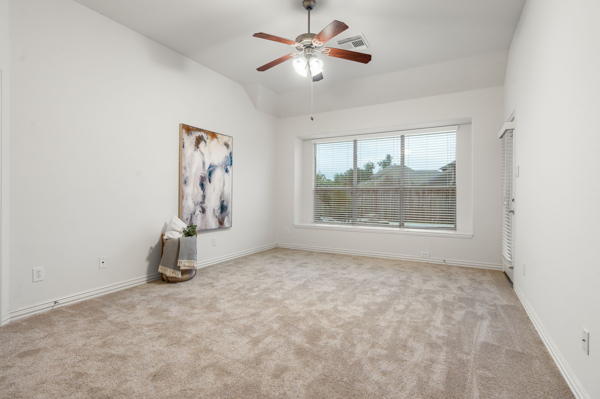 307 Arbor Ridge Lane Conroe, TX 77384 - Photo 18 of 50 an empty room with windows and fan