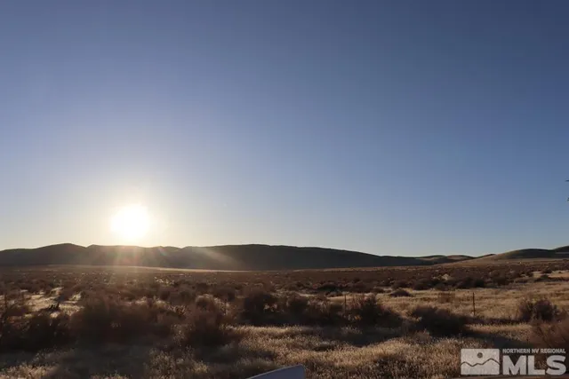 a view of mountain with sunset