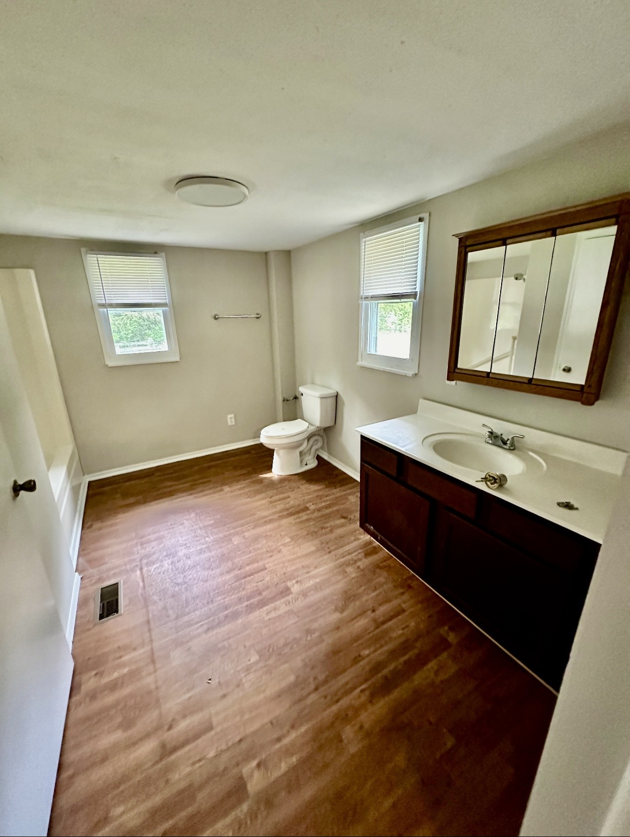 1445 Old Lascassas Road Murfreesboro, TN 37130 - Photo 12 of 18 a spacious bathroom with a double vanity sink a mirror and a bathtub