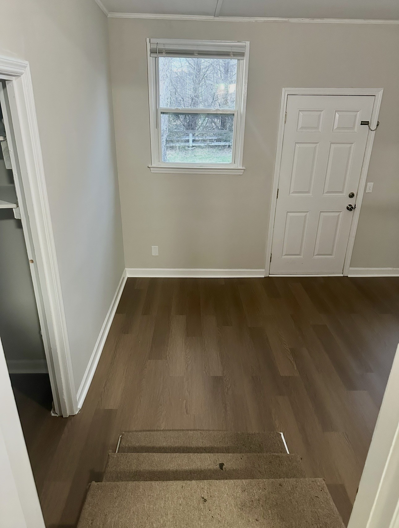 1445 Old Lascassas Road Murfreesboro, TN 37130 - Photo 13 of 18 an empty room with wooden floor and windows