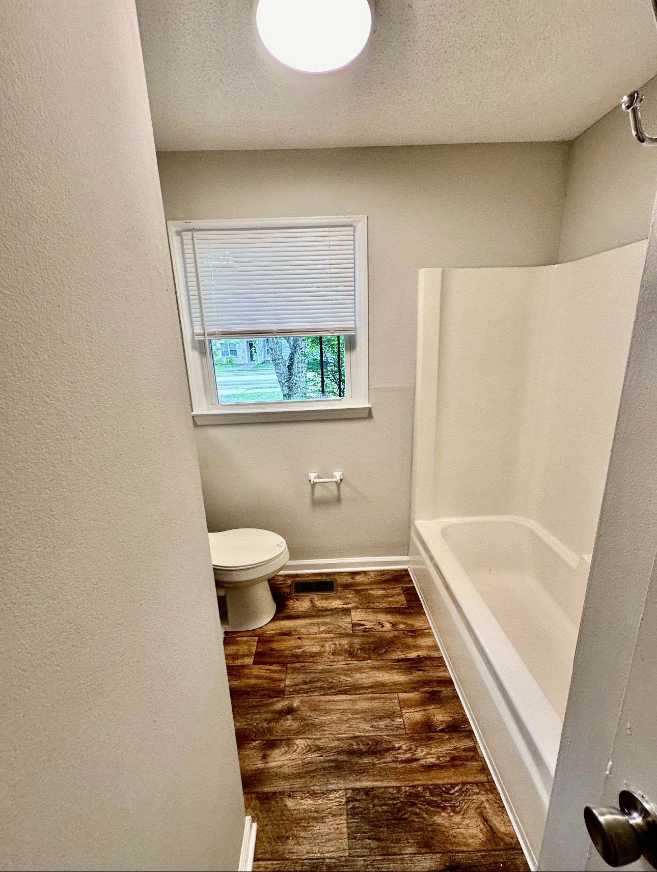 1445 Old Lascassas Road Murfreesboro, TN 37130 - Photo 8 of 18 a bathroom with a bathtub and a toilet