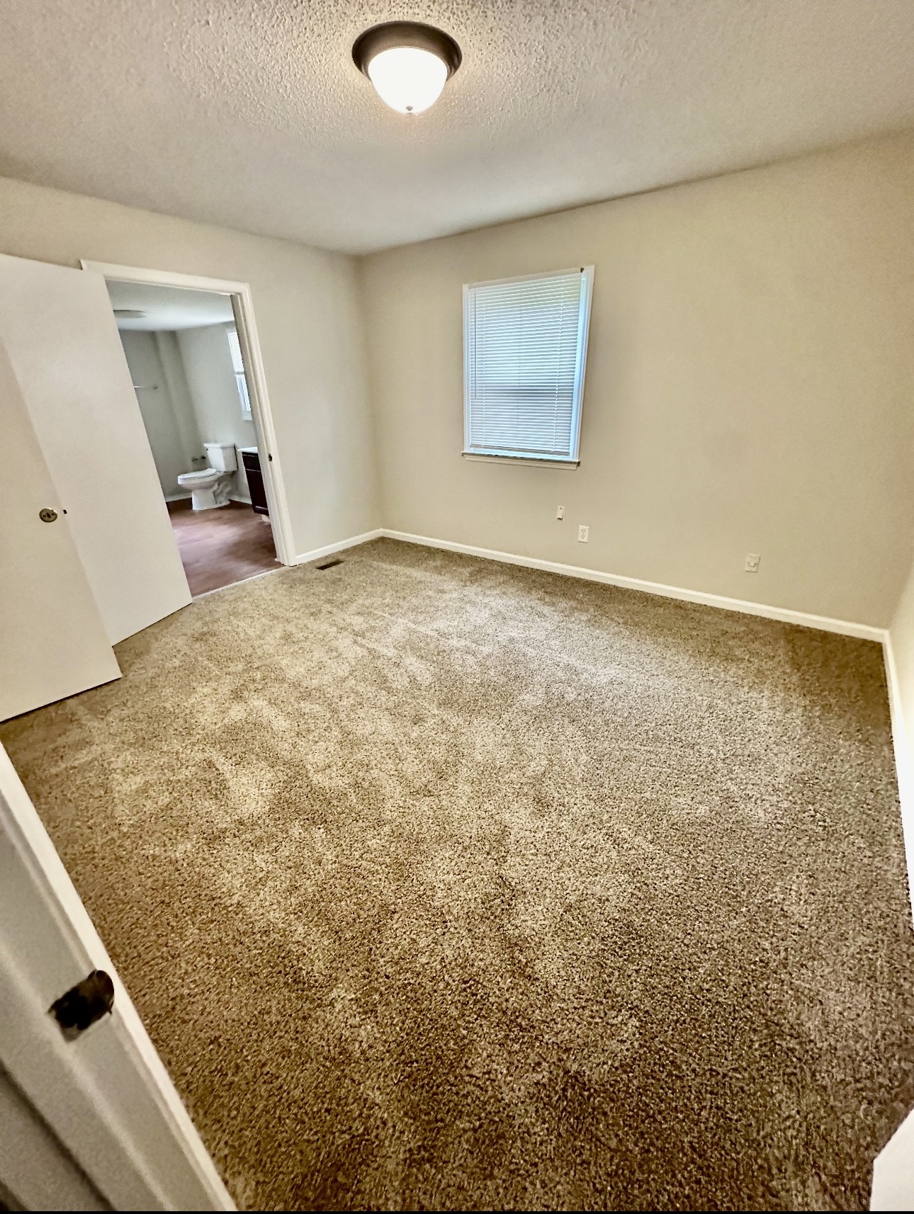 1445 Old Lascassas Road Murfreesboro, TN 37130 - Photo 10 of 18 a view of an empty room and a window