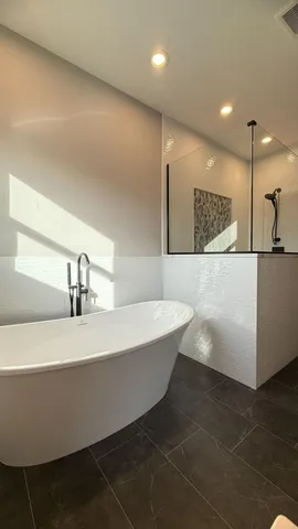 a bathroom with a bathtub and a sink