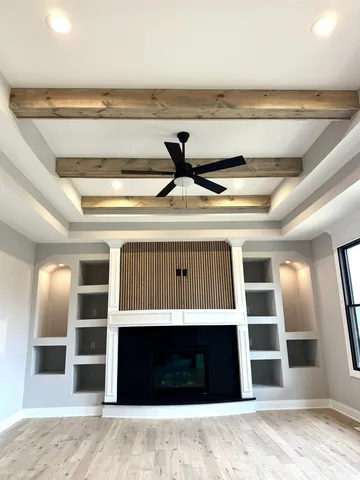 a view of an empty room with a fireplace