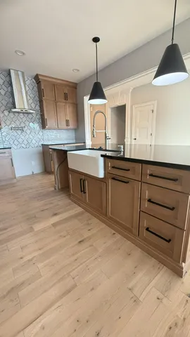 a room with a sink and a mirror