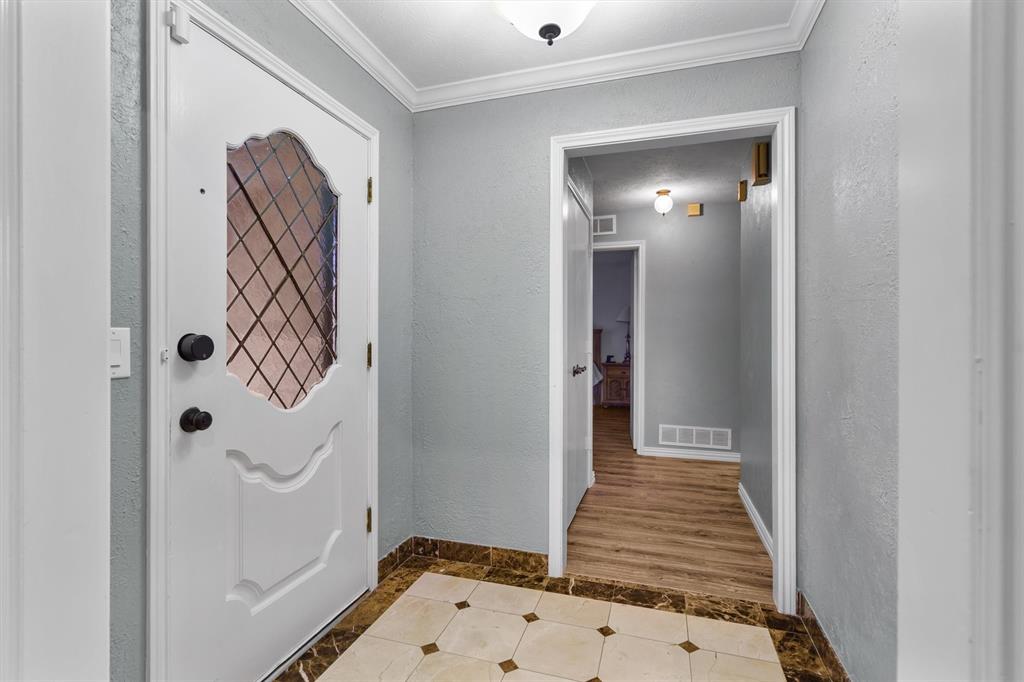 2214 Valley Mill Carrollton, TX 75006 - Photo 5 of 36 a view of a hallway with wooden floor and entryway