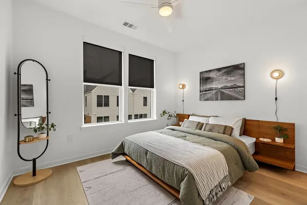 a bedroom with bed and window