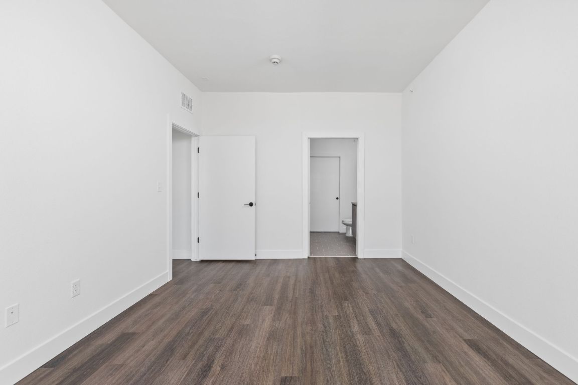 4315 South Congress Avenue, Unit 527 Austin, TX 78745 - Photo 16 of 37 a view of an empty room with wooden floor