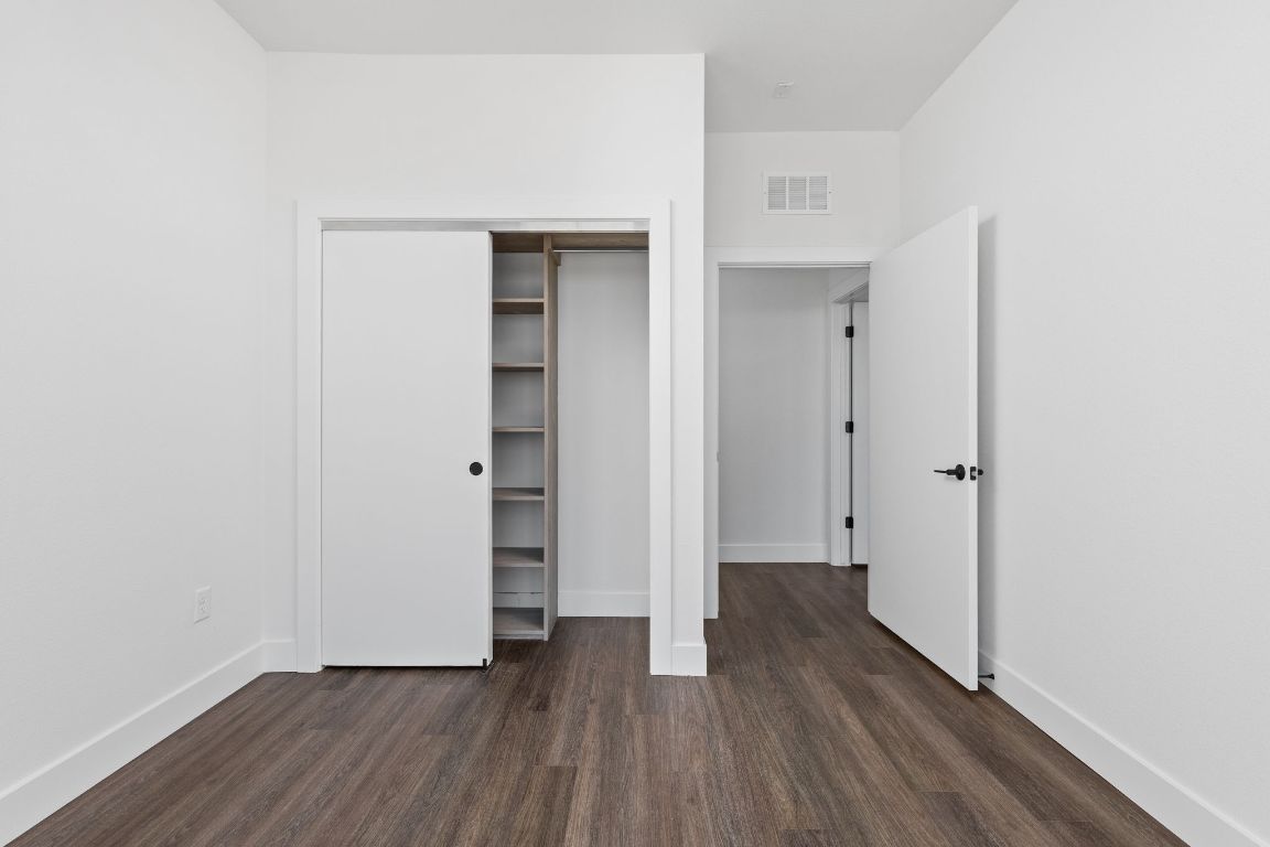 4315 South Congress Avenue, Unit 527 Austin, TX 78745 - Photo 21 of 37 a view of a hallway with wooden floor