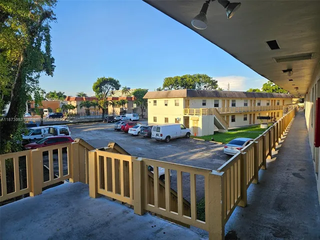 a view of a balcony with two chairs and a table