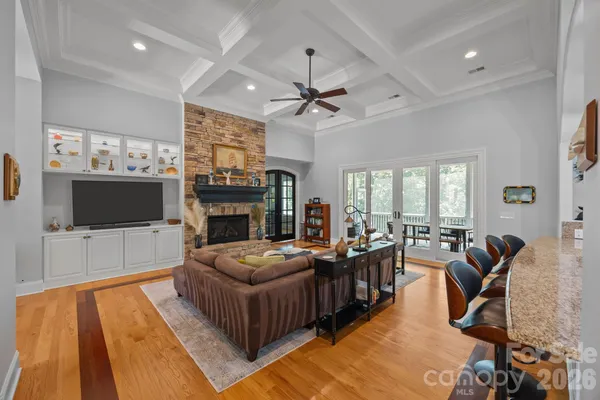 a living room with fireplace furniture and a flat screen tv