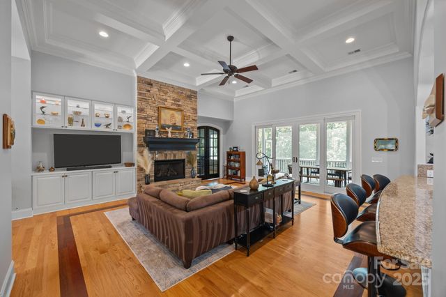 a living room with fireplace furniture and a flat screen tv