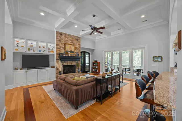 a living room with fireplace furniture and a flat screen tv