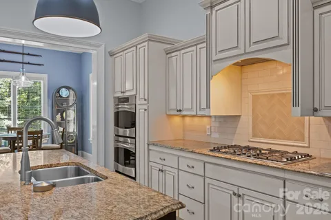a view of a porch with furniture and wooden floor