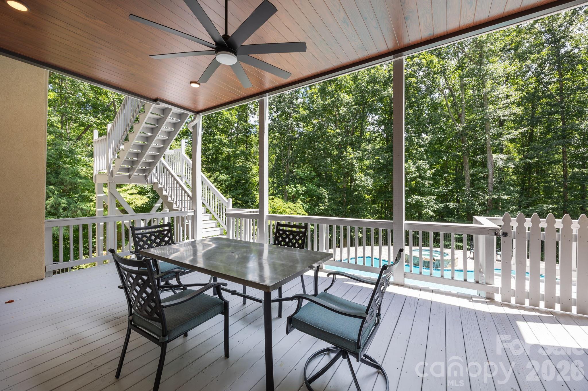 242 Anniston Way Davidson, NC 28036 - Photo 27 of 42 a view of a porch with furniture and wooden floor