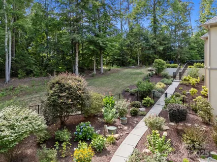 an aerial view of a house with outdoor space