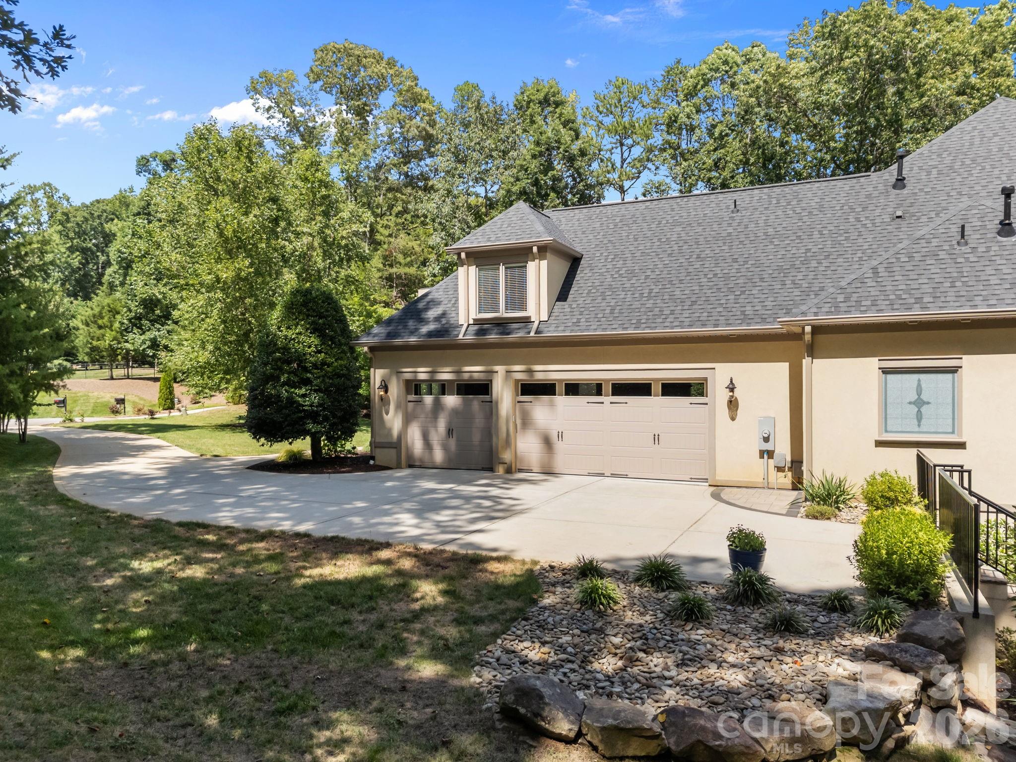 242 Anniston Way Davidson, NC 28036 - Photo 4 of 42 a front view of a house with a yard