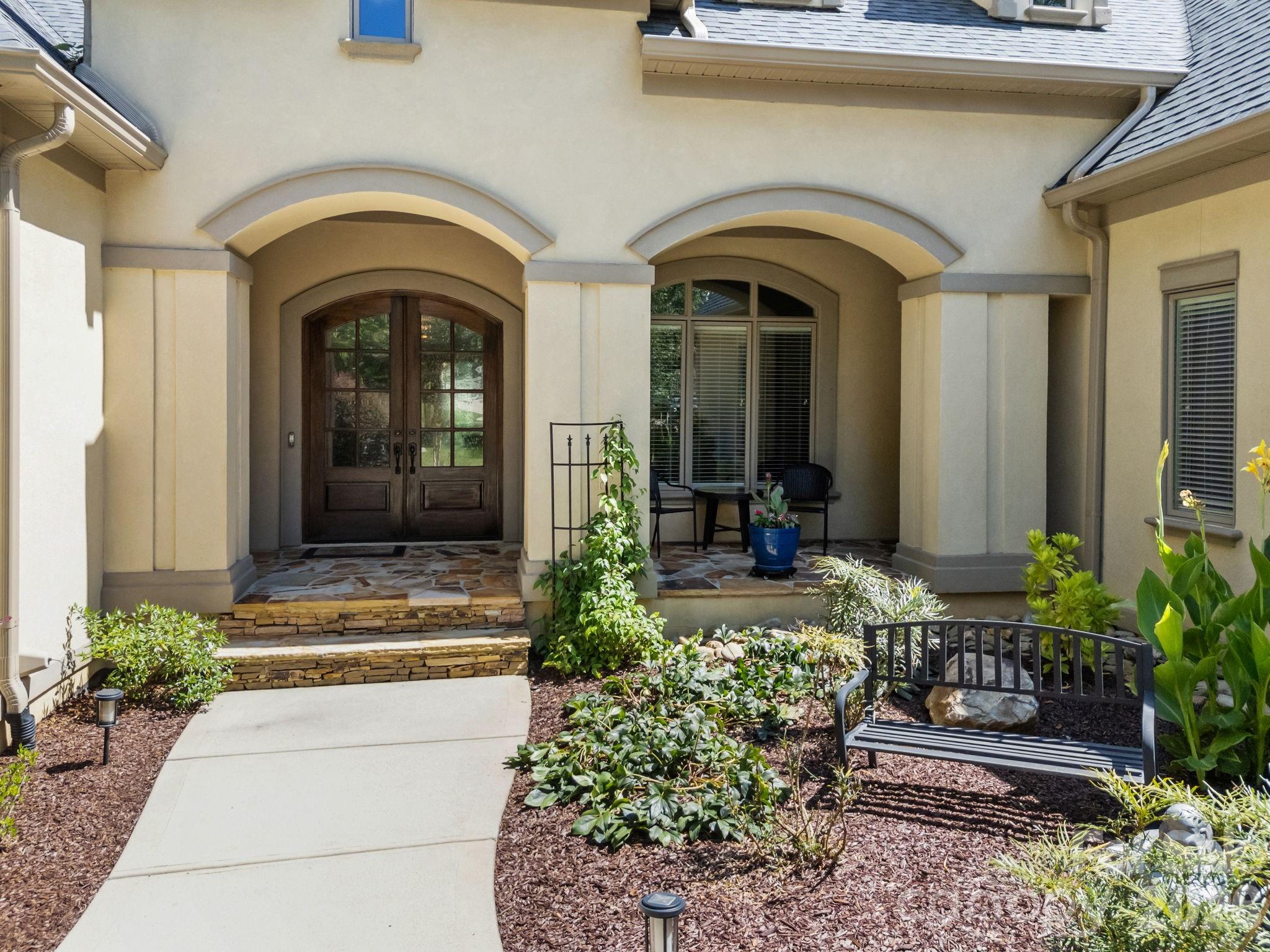 242 Anniston Way Davidson, NC 28036 - Photo 5 of 42 a front view of a house with garden