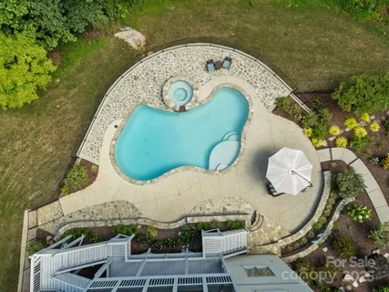 an aerial view of a swimming pool and outdoor space