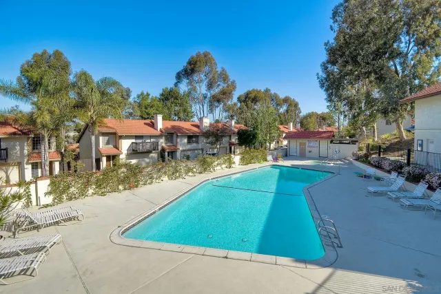 a view of a swimming pool with a patio