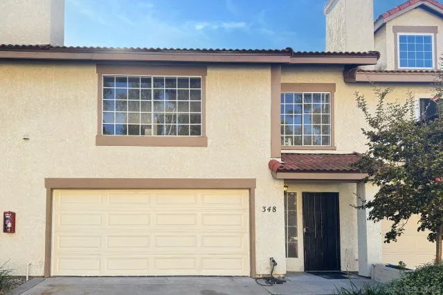 a front view of a house with a garage
