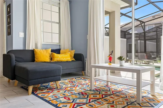 a living room with furniture and a table