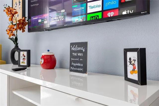 a bedroom with a bed a table and chairs