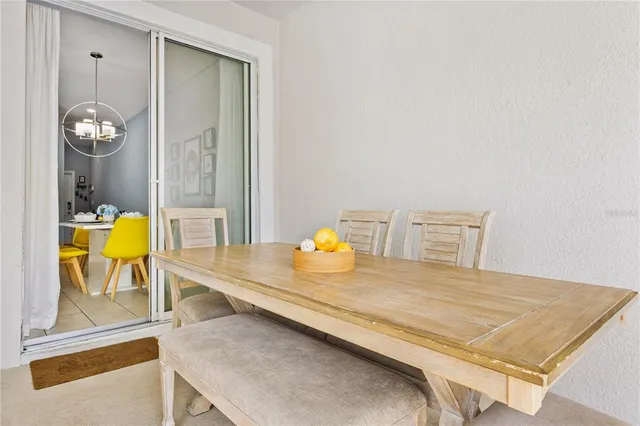 a view of a balcony with table and chairs