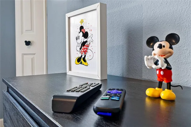 a kitchen with a sink dining table and chairs
