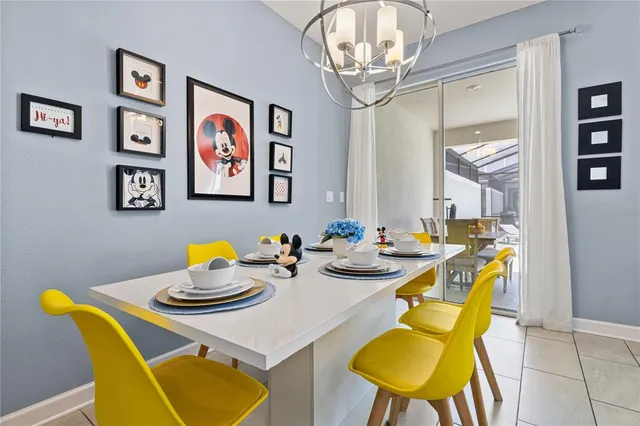 a bathroom with a toilet sink and a large mirror