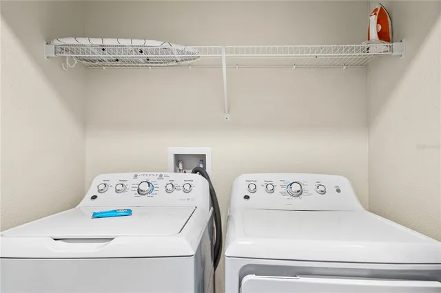 a utility room with dryer and washer