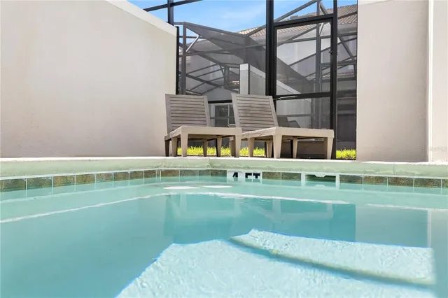 a view of building with a swimming pool