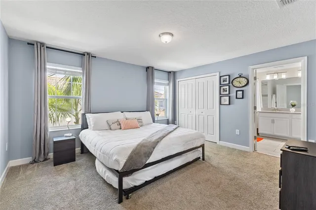 a bedroom with a bed and a cabinets