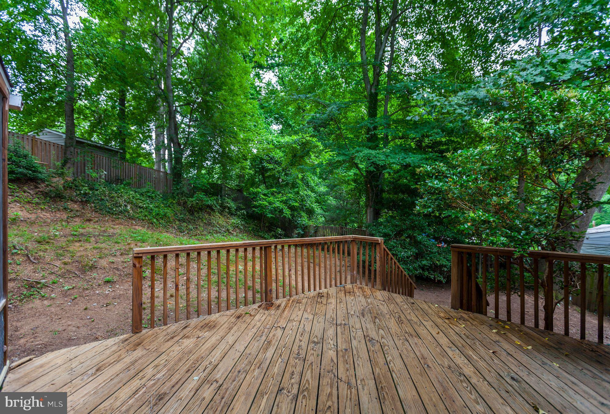 105 Belton Road Silver Spring, MD 20901 - Photo 17 of 18 a balcony with wooden floor and fence