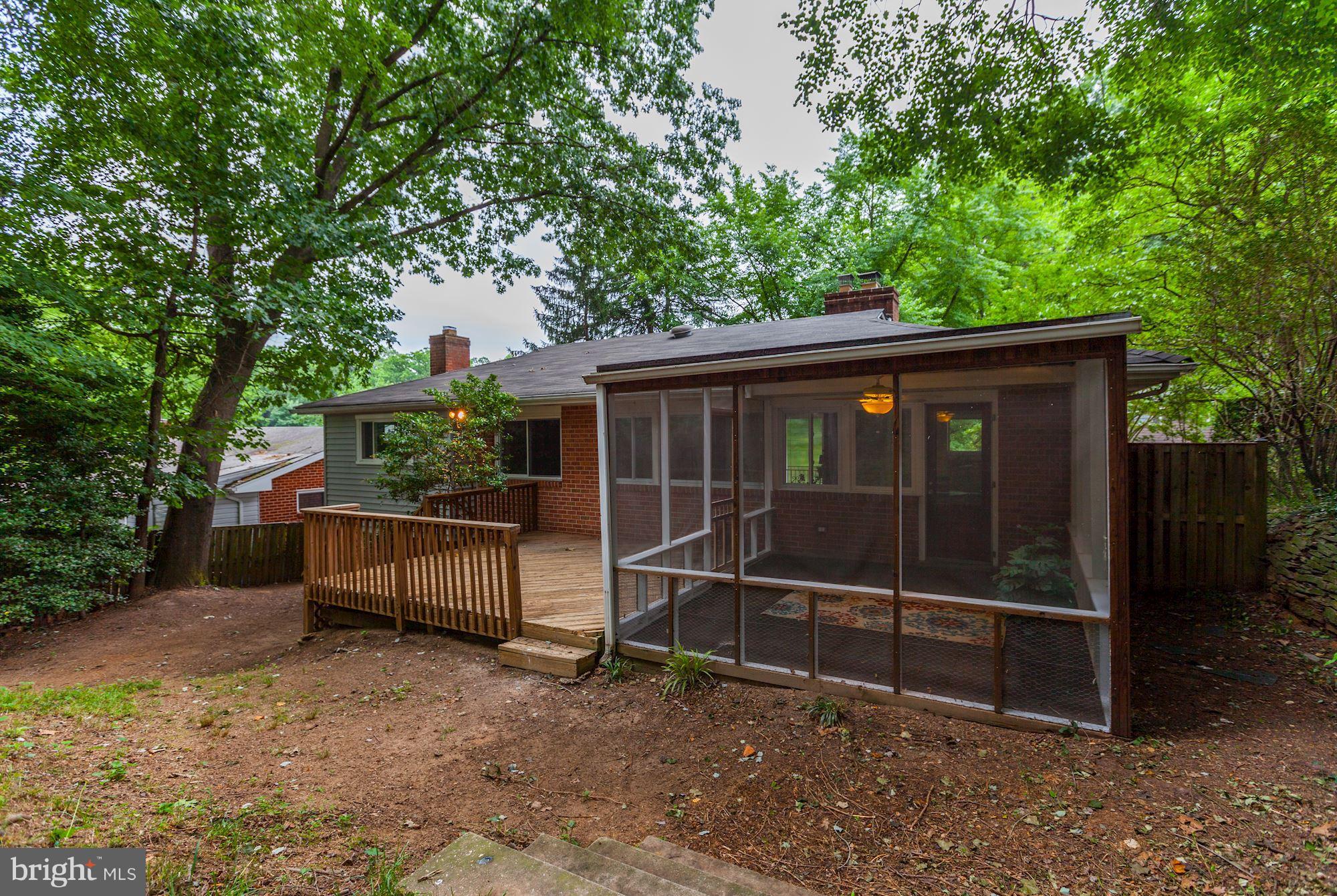 105 Belton Road Silver Spring, MD 20901 - Photo 18 of 18 a view of a house with a large window and yard