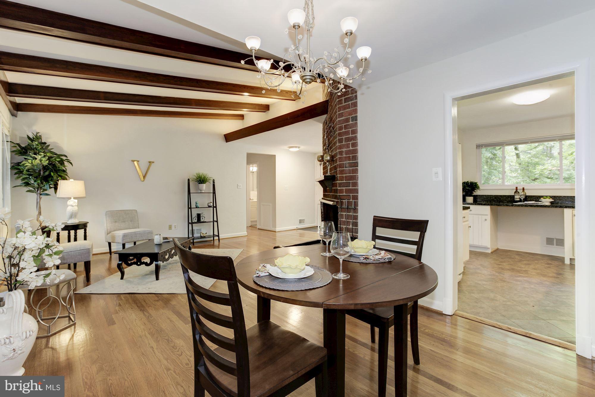 105 Belton Road Silver Spring, MD 20901 - Photo 4 of 18 a view of a dining room with furniture and wooden floor