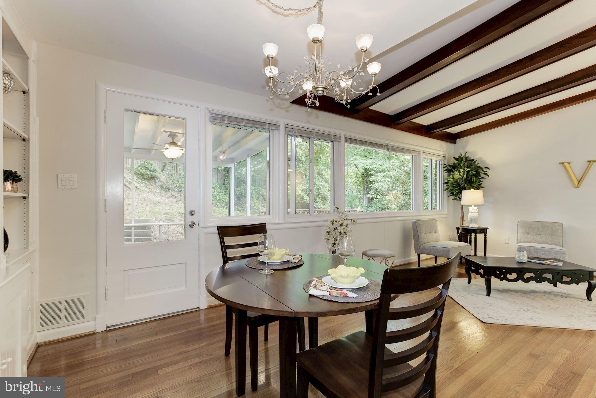 105 Belton Road Silver Spring, MD 20901 - Photo 5 of 18 a view of a dining room with furniture window and wooden floor