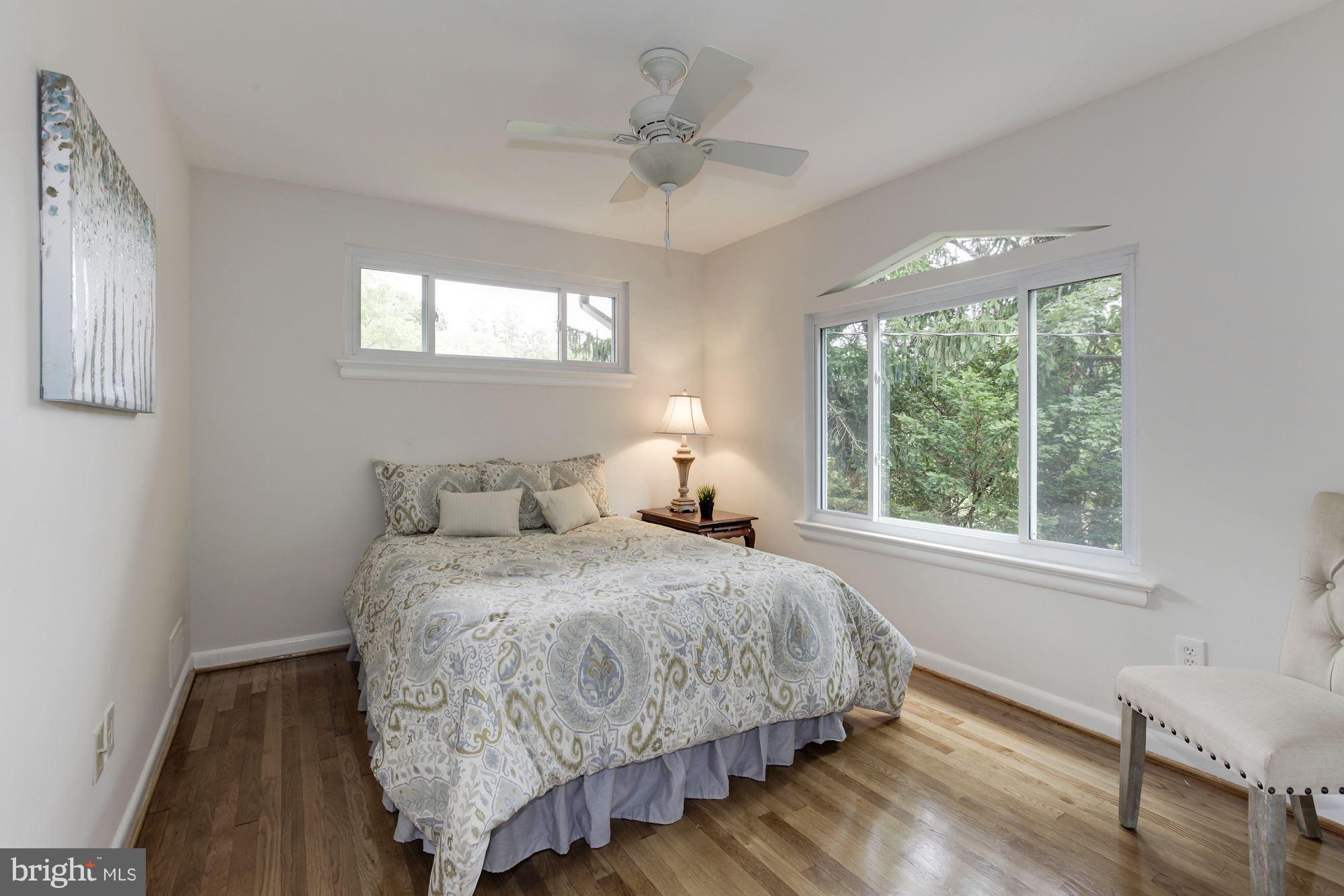 105 Belton Road Silver Spring, MD 20901 - Photo 10 of 18 a bedroom with a bed and window