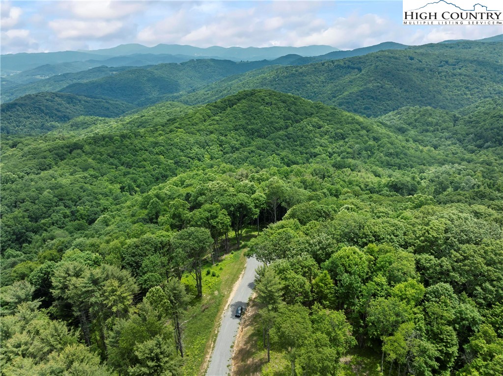 6964 Beech Mountain Road Banner Elk, NC 28604 - Photo 7 of 36 a view of a field with an ocean