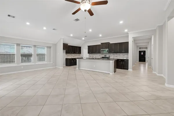 a view of kitchen with stainless steel appliances cabinets and a counter top space